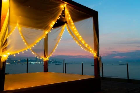 Beach daybed tent at sunset Stock Photos