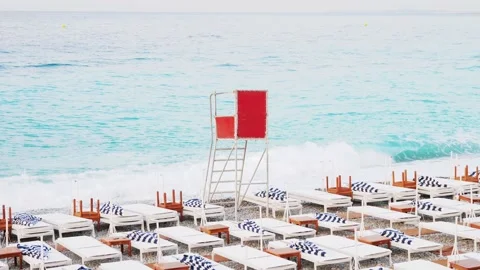 Beach deck chair on a sandy beach by the turquoise sea. Panoramic lounger with Stock Footage 201486698