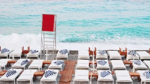 Beach deck chair on a sandy beach by the turquoise sea. Panoramic lounger with Video stock 209621551