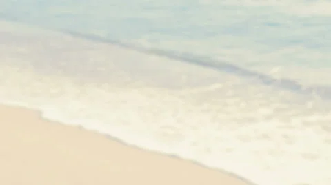 On the Beach - defocused shot of waves rolling on the beach - seamless loop Vídeo Stock 64655283