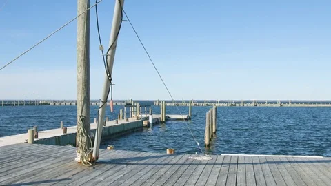 Beach dock during the summer with blue ocean Stock Footage 76591506