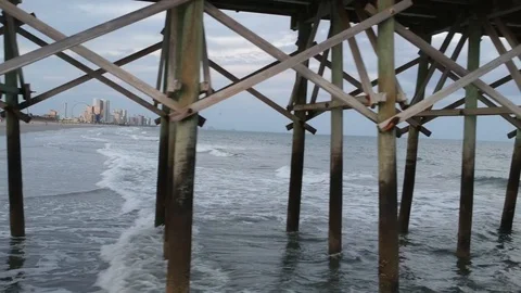 Beach Docks Water Waves Side Fly-by Shot at Myrtle Beach Stock Footage 106762365
