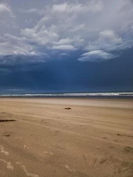 Beach with Dramatic Clouds Stock Photos