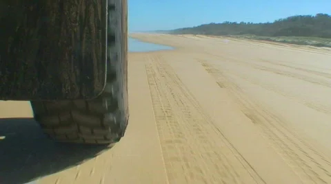 Beach driving low shot Stock Footage 619004