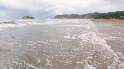Beach Drone Shot Parallel to Breaking Waves Stock Footage 220804927