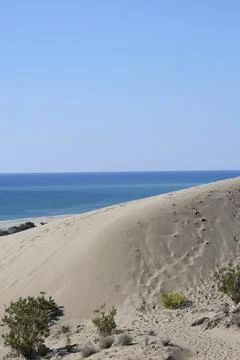 Beach dunes mountains Stock Photos