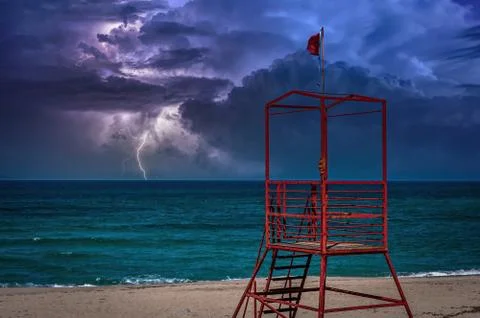 Beach during the storm with lightning Stock Photos