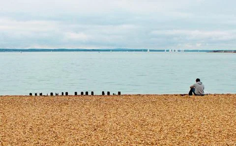 Beach effects man alone on beach concept of mental health, lonely Stock Photos
