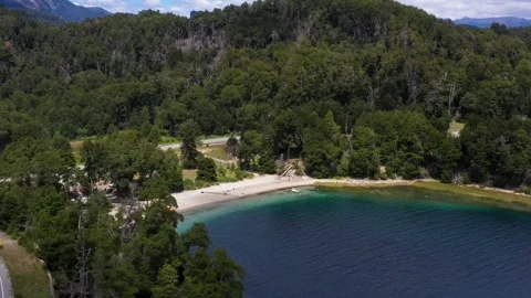 Beach with emerald pristine waters besides the "ruta de los siete Lagos" Stock Footage 256183318