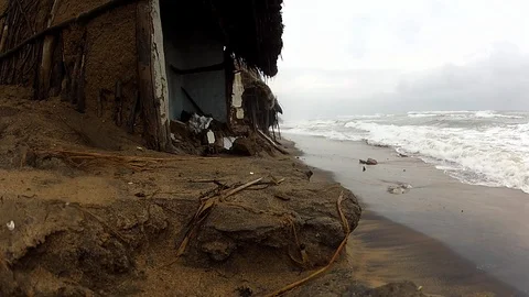 Beach Erosion with Waves Hitting Broken Houses at East Coast of India Video stock 86628566