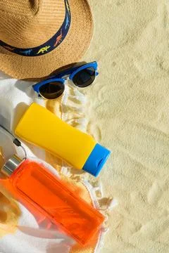 Beach Essentials with Hat, Sunglasses, Sunscreen and Water Bottle. Summer V.. Stock Photos