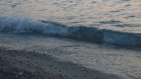 Beach on evening with waves real time footage Video stock 83175814