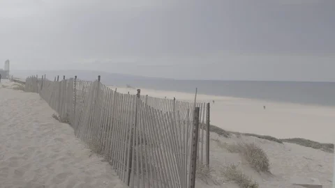 Beach Fence With Beach And Ocean Stock Footage