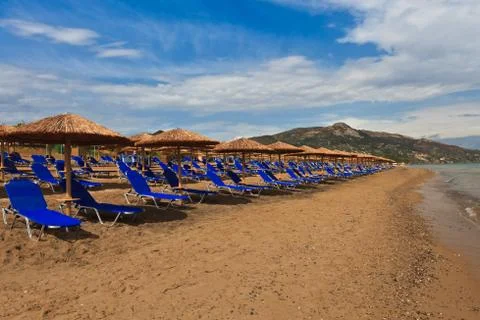 A beach filled with sun beds Stock Photos