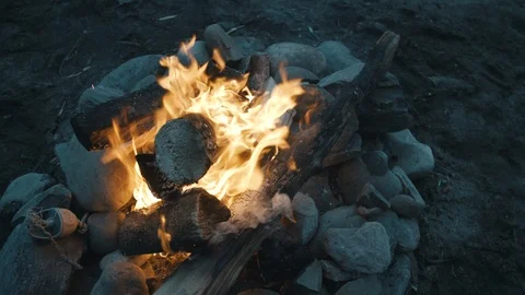 Beach fire pit in pacific northwest at cloudy sunset Stock Footage 96085256