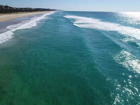 Beach flight over surf Stock Footage 79549491