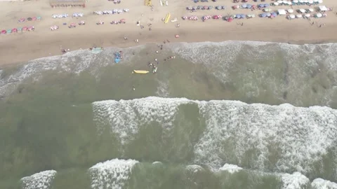 Beach with floating waves drone view Video stock 245839795
