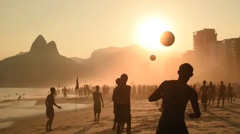 Beach Football by Sunset Stock Footage