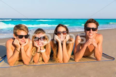 Beach friends together tourits portrait on the sand Stock Photos