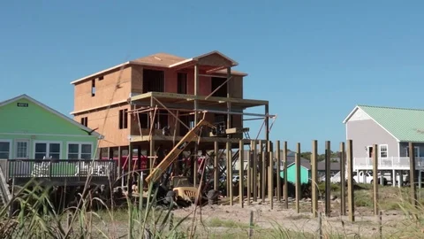 Beach Front Beach House Under Construction Blue Sky with Birds Flying Stock Footage 77916767