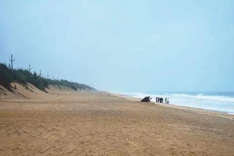 Beach in front of blue ocean Stock Photos