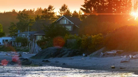 Beach Front Coastal Homes, Bright Sun Lens Flare and Sun, Pacific North West Stock Footage 87203514