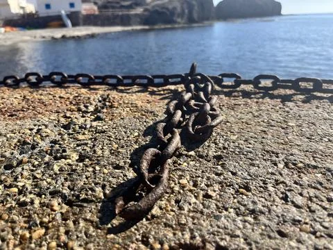 Beach front dock with chain Foto stock