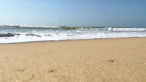 Beach with gentle waves and clear blue sky Video stock 341932004