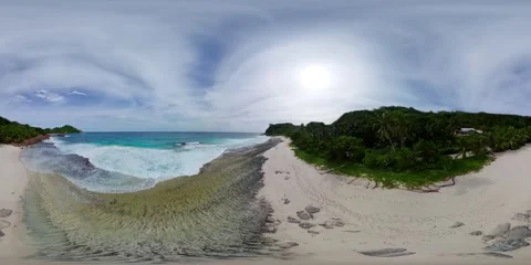 Beach with gentle waves and green hills. Mahe, Seychelles. Stock Footage 301789595
