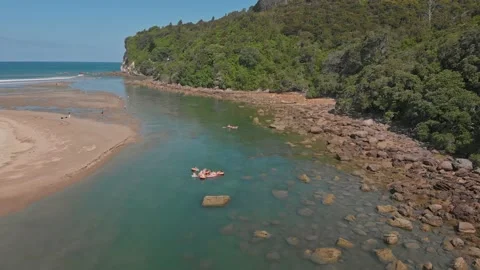 Beach goers enjoying their summer vacation, Whangamata, New Zealand Stock Footage 147160774