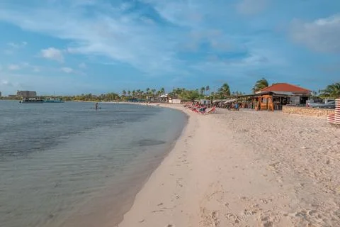 Beach goers at sunset Surfside Beach Aruba Stock Photos