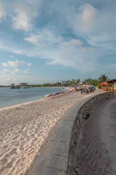 Beach goers at sunset Surfside Beach Aruba Stock Photos