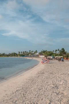 Beach goers at sunset Surfside Beach Aruba Stock Photos