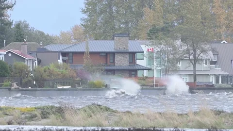 Beach Grove Storm High Tide Homes Pan Stock Footage 163860803