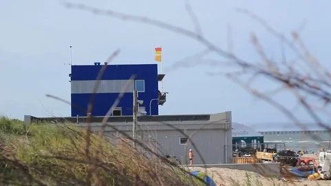 Beach guards house with flag Stock Footage 99118636