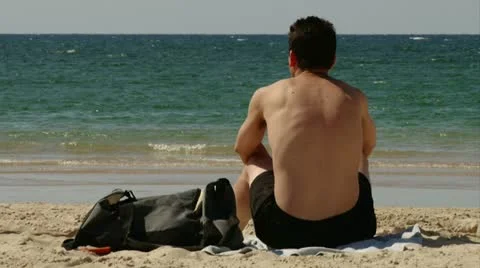 Beach Guy watching sea Stock Footage 20507001