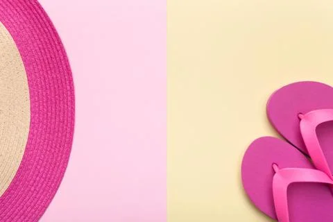 Beach Hat and Flip Flops on Pastel Background Stock Photos