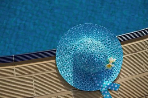 Beach hat next to the pool, top view with space for your text Stock Photos