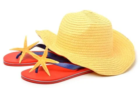 Beach hat, red flip flops with starfishes Stock Photos