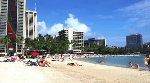 A beach in Hawaii with buildings in the background 動画素材 10877967