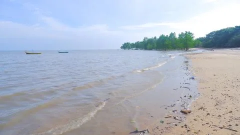 Beach At High Tide During The Day Stock Photos