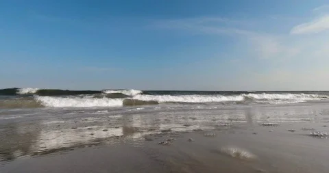 BEACH HORIZON LOW ANGLE WAVES SUNNY DAY - ATLANTIC OCEAN Stock Footage 87150565
