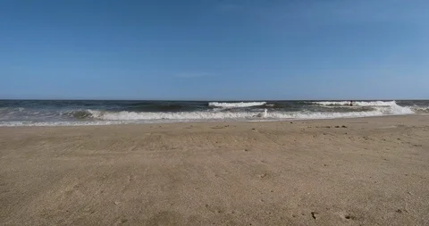 BEACH HORIZON LOW ANGLE WAVES SUNNY DAY - ATLANTIC OCEAN Stock Footage 87186320