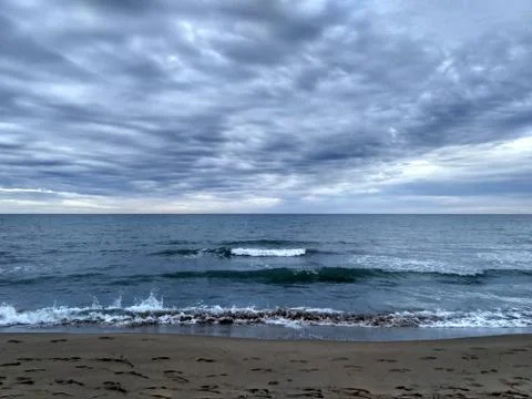 Beach horizon view on a cloudy day Stock Photos