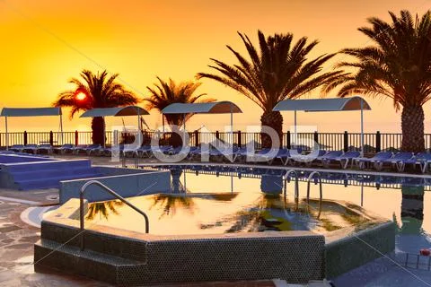 Beach hotel resort with pool at dawn Stock-Fotos