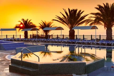 Beach hotel resort with pool at dawn Stock Photos