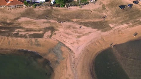 A beach with a house in the background Stock Footage 328387405