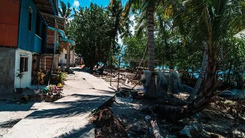 A beach with a house in the background Stock Photos