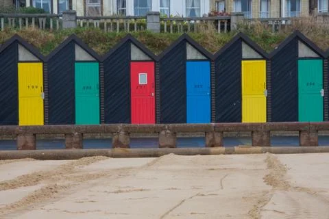 Beach huts on beach Stock Photos