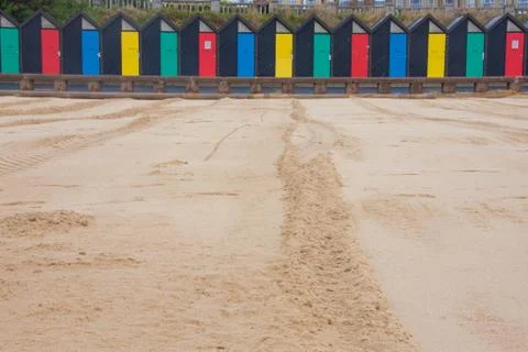 Beach huts on beach Stock Photos